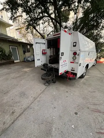 Magnet Plumbing service vehicle on-site for Grease Trap Cleaning in Boggy Creek